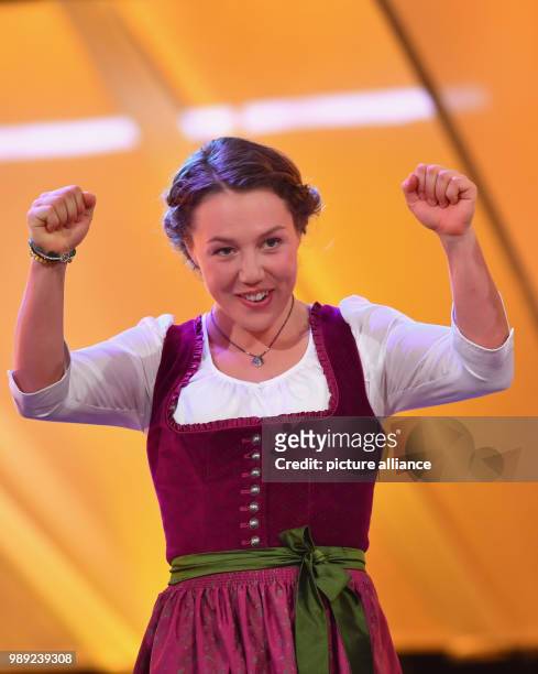 Biathlete Laura Dahlmeier stands onstage during the election to "Athlete of the year" at the Kurhaus in Baden-Baden, Germany, 17 December 2017....