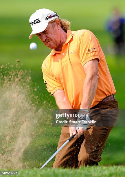 Miguel Angel Jimenez of Spain plays his bunker shot on the 17th hole during the third round of the BMW Italian Open at Royal Park I Roveri on May 8,...