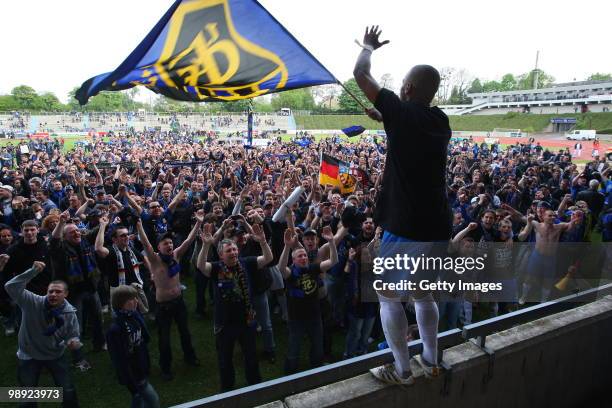 Mark Lerandy of Saarbruecken celebrates with fans after the Regionalliga match between Bonner SC and 1.FC Saarbruecken at the ARENA stadium on May 8,...