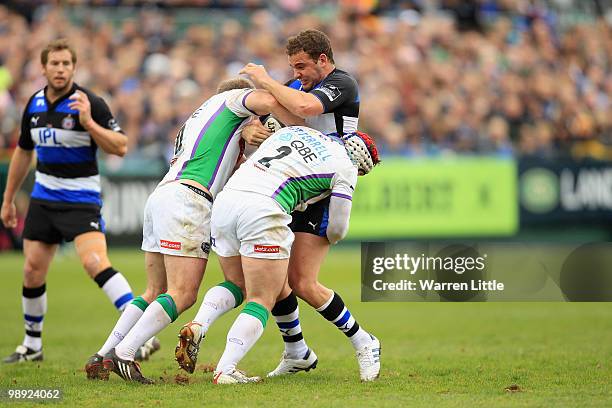 Olly Barkley of Bath is tackled by Ceiron Thomas and Andy Titterell of Leeds Carnegie during the Guinness Premiership match between Bath and Leeds...