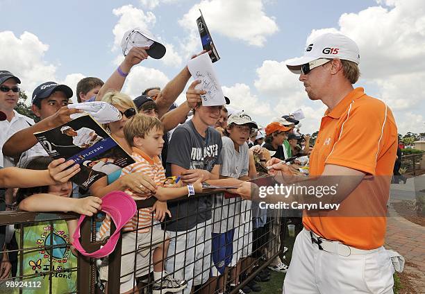 Hunter Mahan signs autographs after the second round of THE PLAYERS Championship on THE PLAYERS Stadium Course at TPC Sawgrass on May 7, 2010 in...