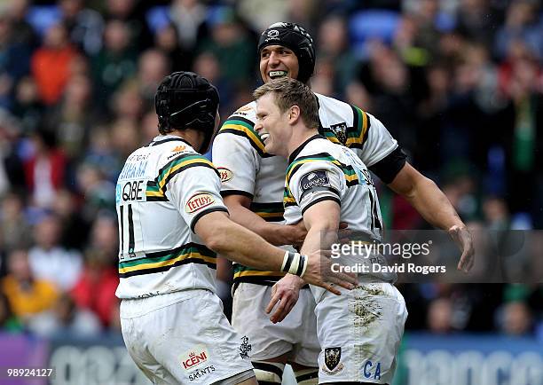 Chris Ashton of Northampton is congrated by team mates Bruce Reihana and Jaundre Kruger after scoring a try during the Guinness Premiership match...