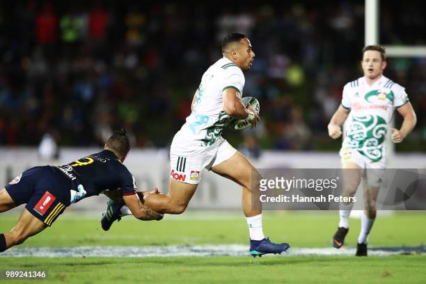 During the round 17: Toni Pulu of the Chiefs makes a break during the Super Rugby match between the Highlanders and the Chiefs at ANZ National...