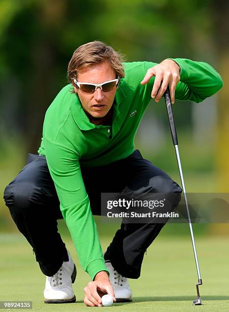 Nicolas Colsaerts of Belgium lines up his putt on the 17th hole during the third round of the BMW Italian Open at Royal Park I Roveri on May 8, 2010...