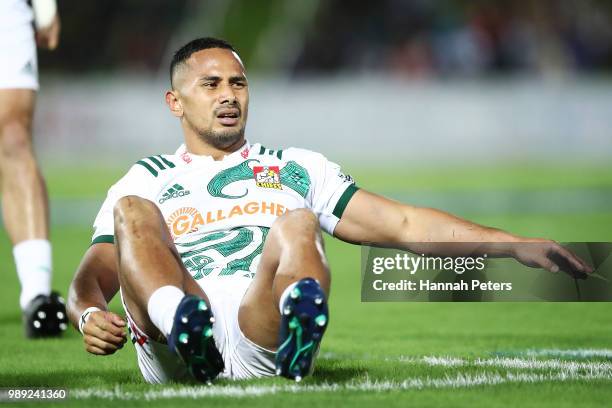 During the round 17: Toni Pulu of the Chiefs sits injured during the Super Rugby match between the Highlanders and the Chiefs at ANZ National Stadium...