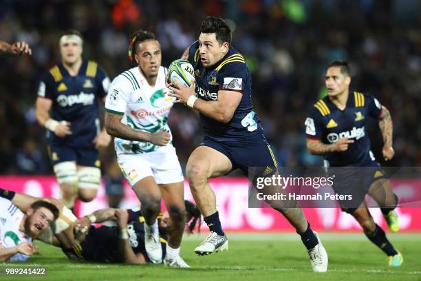 During the round 17: Rob Thompson of the Highlanders makes a break during the Super Rugby match between the Highlanders and the Chiefs at ANZ...