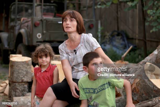Picture of English teacher Tamar Janelidse, wife of cone picker Michail Murusidse, and their children, taken in the Racha-Lechkhumi district in...
