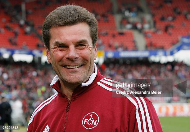 Head coach Dieter Hecking of Nuernberg smiles before the Bundesliga match between 1. FC Nuernberg and 1. FC Koeln at Easy Credit Stadium on May 8,...