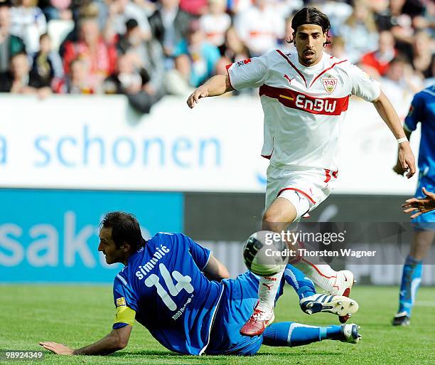 Josip Simunic of Hoffenheim battles for the ball with Sami Khedira of Stuttgart during the Bundesliga match between TSG 1899 Hoffenheim and VFB...