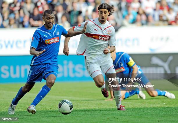 Marvin Compper of Hoffenheim battles for the ball with Sami Khedira of Stuttgart during the Bundesliga match between TSG 1899 Hoffenheim and VFB...