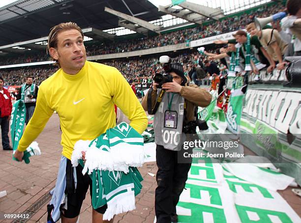 Goalkeeper Tim Wiese of Bremen celebrates with the fans after the Bundesliga match between SV Werder Bremen and Hamburger SV at Weser Stadium on May...