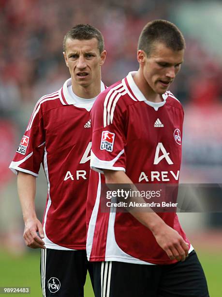 Marek Mintal and Christian Eigler of Nuernberg react during the Bundesliga match between 1. FC Nuernberg and 1. FC Koeln at Easy Credit Stadium on...