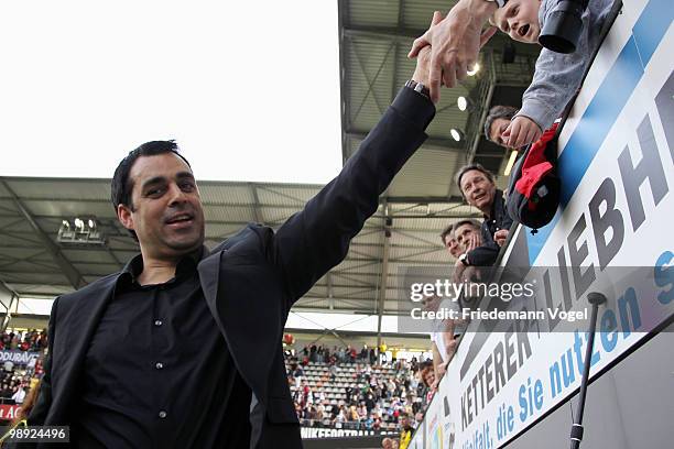 Head coach Robin Dutt of Freiburg celebrates after the Bundesliga match between SC Freiburg and Borussia Dortmund at Badenova stadium on May 8, 2010...