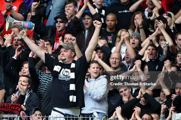 Supporters of Frankfurt cheer their team during the Bundesliga match between VfL Wolfsburg and Eintracht Frankfurt at Volkswagen Arena on May 8, 2010...