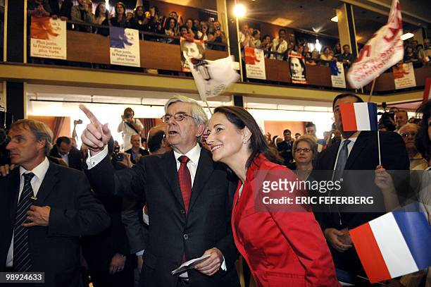 French socialist presidential candidate Segolene Royal chats with Belfort's mayor Jean Pierre Chevenement as they arrive to attend a meeting, 13...