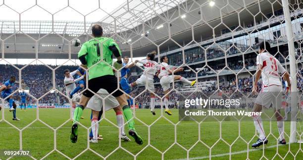 Boris Vukcevic of Hoffenheim scores his team's first goal against goalkeeper Jens Lehmann of Stuttgart during the Bundesliga match between TSG 1899...