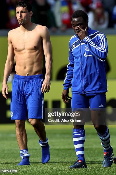 Kevin Kuranyi and Gerald Asamoah of Schalke react as they leave the pitch after the Bundesliga match between FSV Mainz 05 and FC Schalke 04 at the...