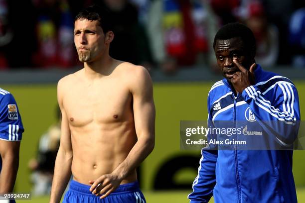 Kevin Kuranyi and Gerald Asamoah of Schalke react as they leave the pitch after the Bundesliga match between FSV Mainz 05 and FC Schalke 04 at the...