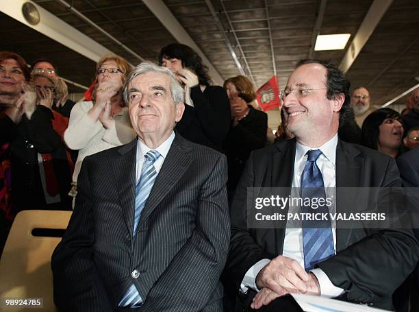 French socialist party first secretary Francois Hollande and head of the Republican and Citizen Movement Jean-Pierre Chevenement attend a support...