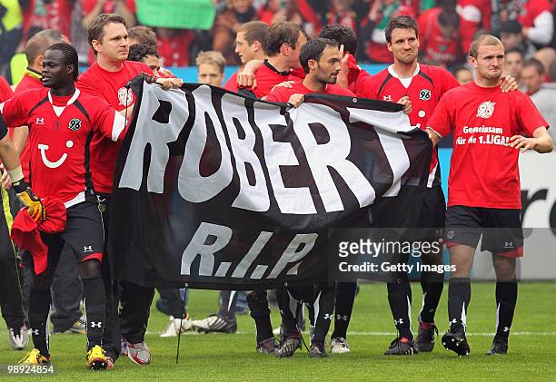 Player of Hannover celebrate and remain goalkeeper Robert Enke after the Bundesliga match between VfL Bochum and Hannover 96 at Rewirpower Stadium on...