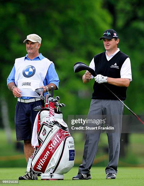 Paul Lawrie of Scotland looks on beside caddie Andy Forsyth on the eighth hole during the third round of the BMW Italian Open at Royal Park I Roveri...