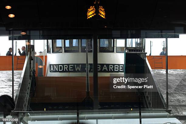 Investigators stand on the Andrew J. Barbieri ferry following the crash of the Staten Island Ferry into a dock in the city's borough of Staten Island...