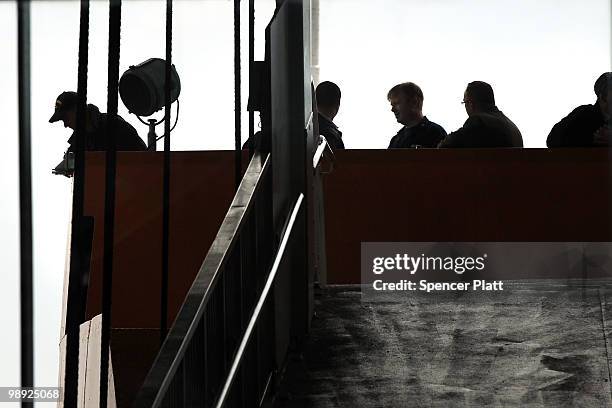 Investigators stand on the Andrew J. Barbieri ferry following the crash of the Staten Island Ferry into a dock in the city's borough of Staten Island...