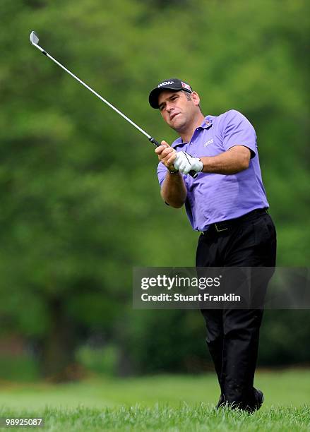 Hennie Otto of South Africa plays his approach shot on the eighth hole during the third round of the BMW Italian Open at Royal Park I Roveri on May...