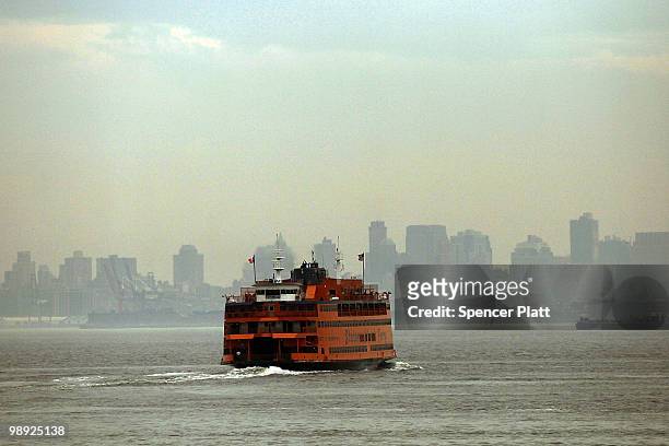 Staten Island Ferry heads towards Manhattan following the crash of another ferry into a dock in the city's borough of Staten Island on May 8, 2010 in...