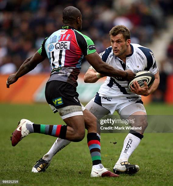 Mark Cueto of Sale avoids a tackle from Ugo Monye of Sharks during the Guinness premiership game between Harlequins and Sale Sharks at The Stoop on...