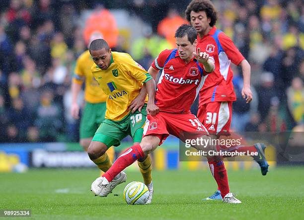 Paul Thirwell of Carlisle battles with Korey Smith of Norwich during the Coca-Cola League One match between Norwich City and Carlisle United at...