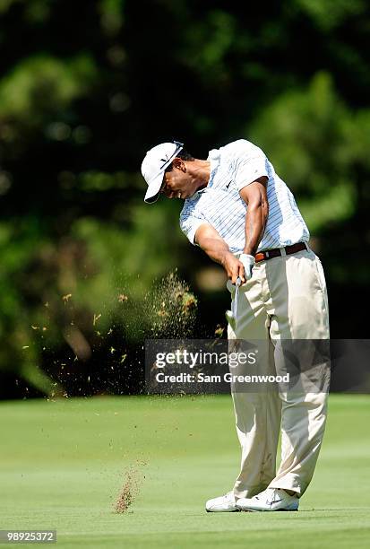 Tiger Woods plays his approach shot on the fairway of the seventh hole during the third round of THE PLAYERS Championship held at THE PLAYERS Stadium...