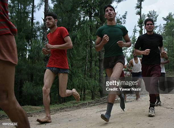 Kashmiri youth subjected to physical test run during a recruitment rally on May 08, 2010 near Pakistan border in Wayin, 100 Kms north of Srinagar,...