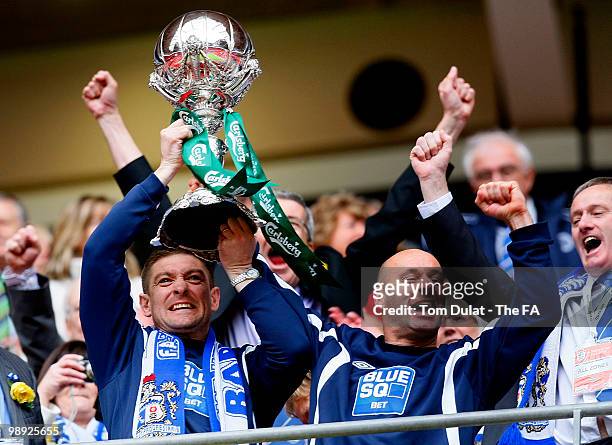 Barrow managers Darren Sheridan and Dave Bayliss celebrate lift the trophy after winning the the FA Carlsberg Trophy Final match between Barrow and...
