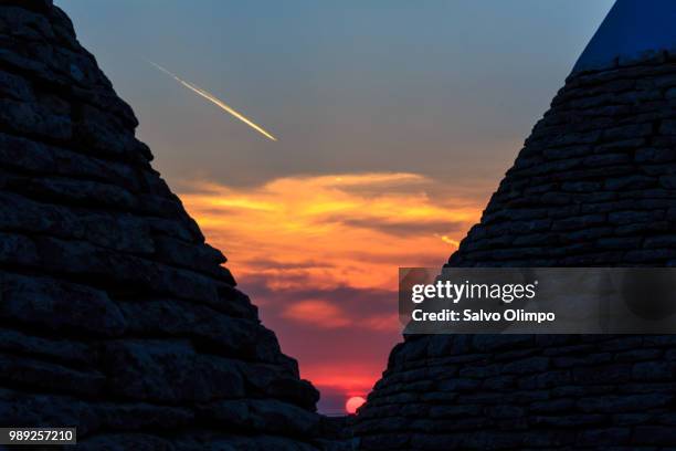 sunset between trulli - barium stock pictures, royalty-free photos & images