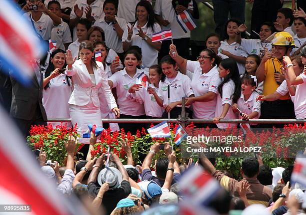 Costa Rican President-elect Laura Chinchilla waves at the crowd on her arrival at La Sabana Metropolitan Park in San Jose for her inauguration on May...