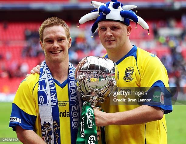 Jason Walker of Barrow celebrates with team mate Lee McEvilly after winning the FA Carlsberg Trophy Final between Barrow and Stevenage Borough at...