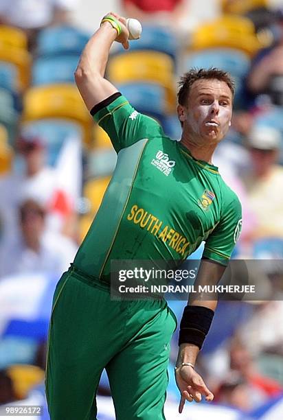 South African cricketer Johan Botha bowls during The ICC World Twenty20 Super 8 match between England and South Africa at the Kensington Oval on May...