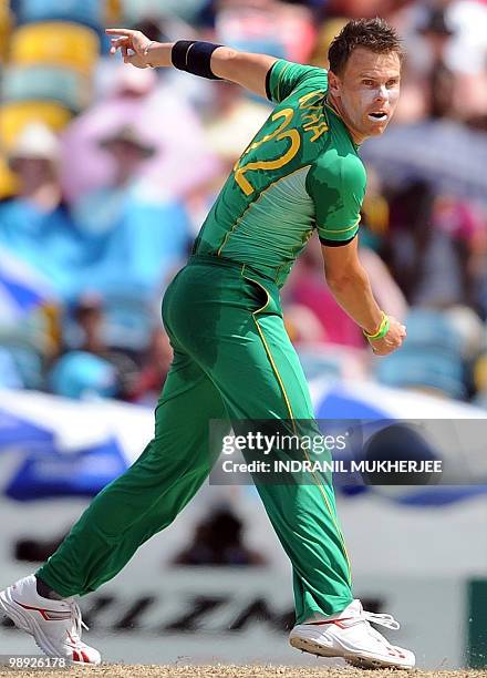 South African cricketer Johan Botha bowls during The ICC World Twenty20 Super 8 match between England and South Africa at the Kensington Oval on May...