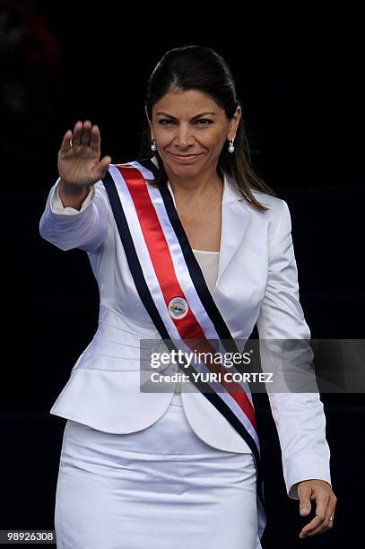 Costa Rican new President Laura Chinchilla, waves at the crowd after being sworn in in her inauguration at La Sabana Metropolitan Park in San Jose on...