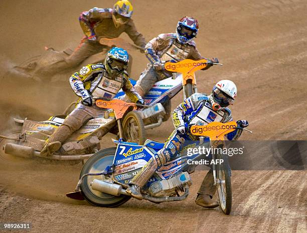 Poland's Rune Holta leads heat five of the Swedish Speedway Grand Prix at Ullevi Stadium in Gothenburg, followed by Denmark's Hans Andersen, Nicki...