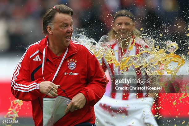 Head coach Louis van Gaal gets a beer shower after winning the German Champions trophy after winning 3-1 the Bundesliga match between Hertha BSC...