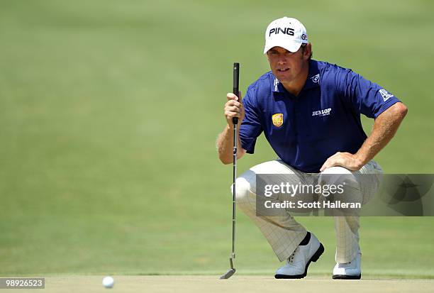 Lee Westwood of England lines up his putt on the second green during the third round of THE PLAYERS Championship held at THE PLAYERS Stadium course...