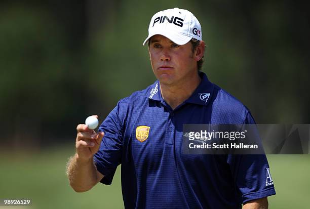 Lee Westwood of England waves to the gallery after putting on the second green during the third round of THE PLAYERS Championship held at THE PLAYERS...