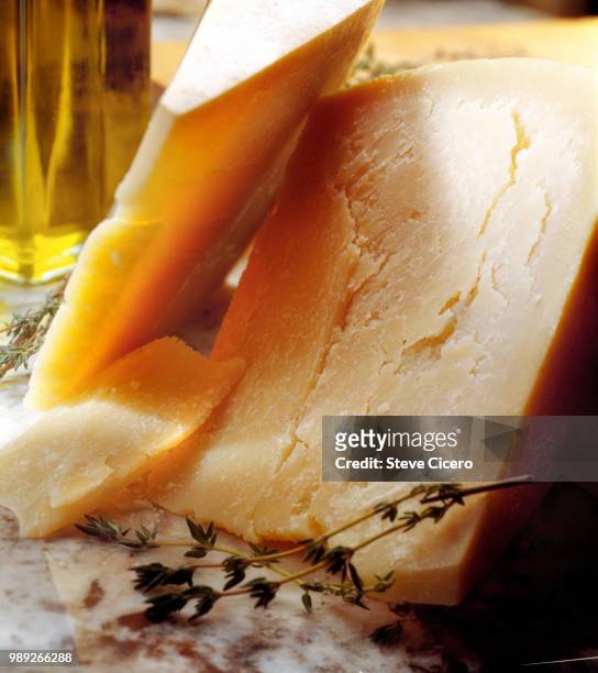 savory hard cheddar cheese on tabletop - cheddar kaas stockfoto's en -beelden