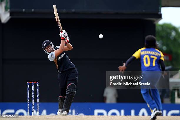 Suzie Bates of New Zealand hits a straightfour off the bowling of Sripali Weerakkody during the ICC T20 Women's World Cup Group B match between New...