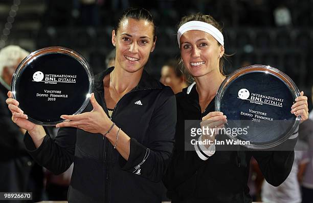 Flavia Pennetta of Italy and teammate Gisela Dulko of Argentina celebrate with their trophies after winning the doubles Final of the Sony Ericsson...