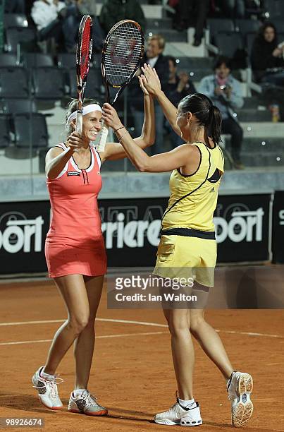 Flavia Pennetta of Italy and teammate Gisela Dulko of Argentina celebrate after winning the doubles Final of the Sony Ericsson WTA Tour against Maria...