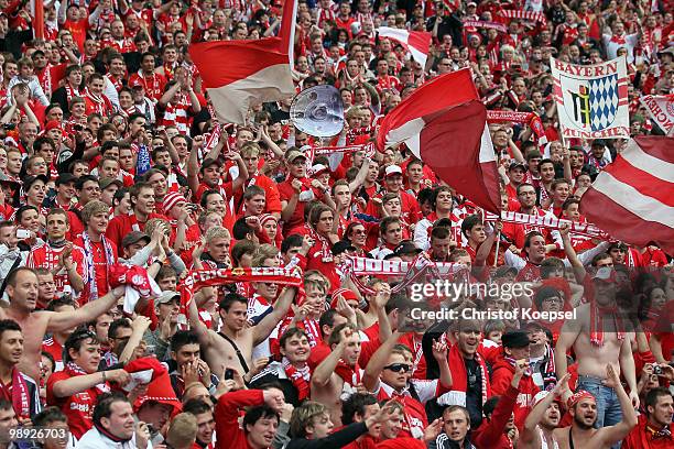 The fans of Bayern celebrate their team after winning the German Champions trophy after winning 3-1 the Bundesliga match between Hertha BSC Berlin...