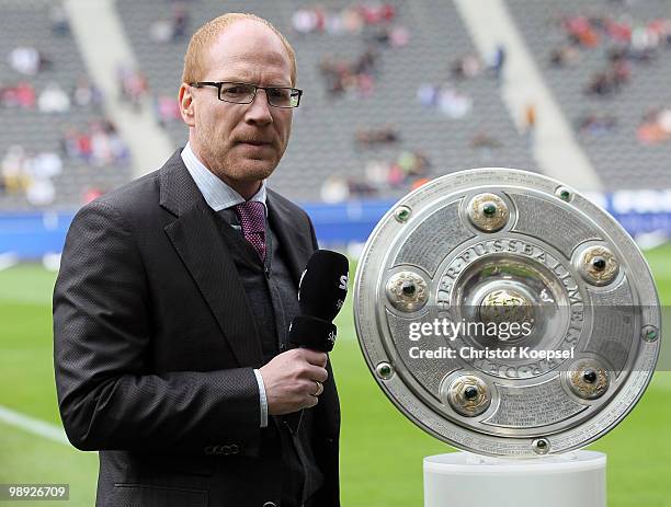 Sporting director Matthias Sammer is seen with the German Champions trophy before the Bundesliga match between Hertha BSC Berlin and FC Bayern...